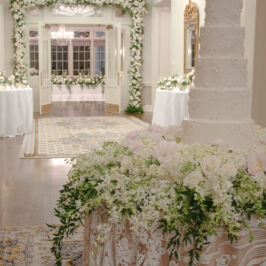wedding florals with archway and cake table decor from Billy Heroman's in Baton Rouge